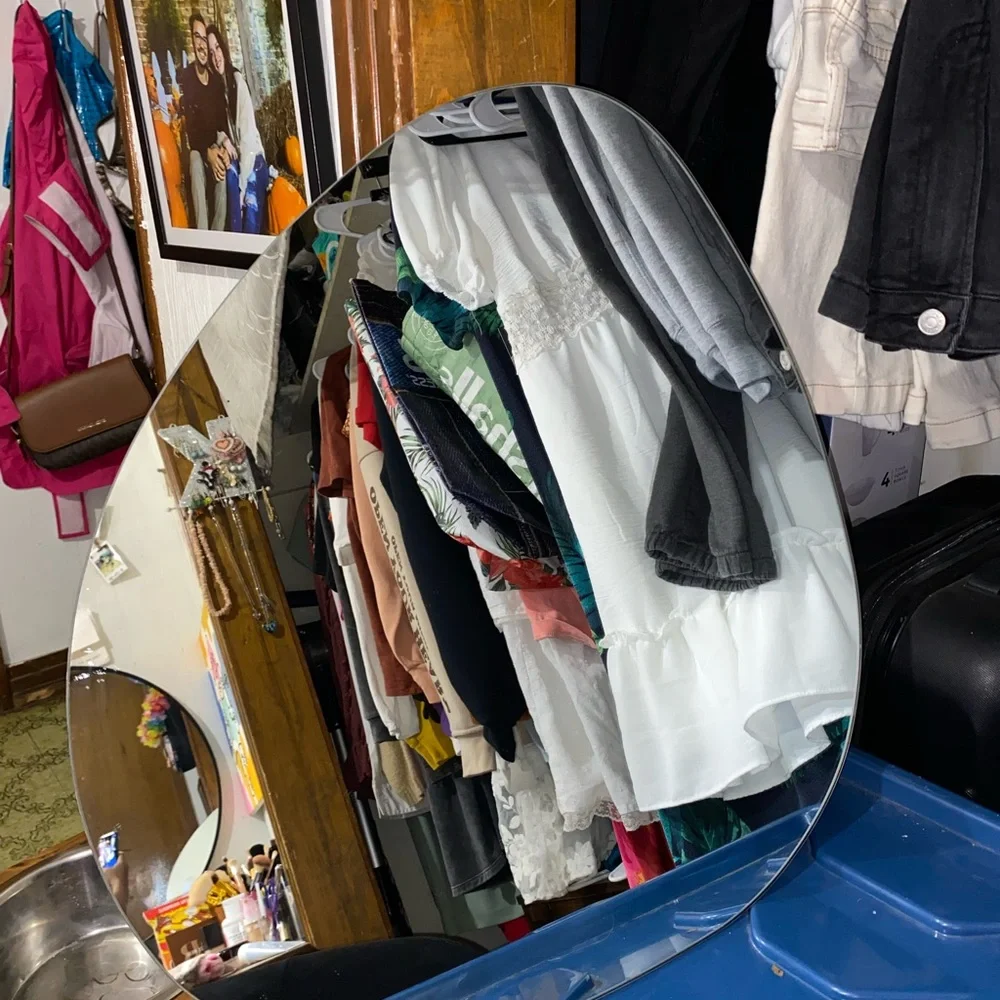Mirror that is odd shaped. It says 20x22 for sizing